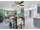 Open-concept space seamlessly blends the living and dining areas, creating a bright atmosphere at 18151 Cochran Blvd, Port Charlotte, FL 33948