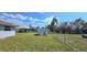 Fenced backyard provides ample green space, an outbuilding and privacy for outdoor activities and relaxation at 18519 Alphonse Cir, Port Charlotte, FL 33948