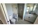 This is a renovated bathroom with a tiled shower, granite vanity, and new toilet at 18519 Alphonse Cir, Port Charlotte, FL 33948