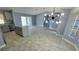 Bright open living space featuring a granite island kitchen and sliding glass doors, inviting for entertaining or relaxing at 18519 Alphonse Cir, Port Charlotte, FL 33948
