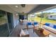 This screened lanai is well staged and offers a perfect outdoor living and dining area at 18519 Alphonse Cir, Port Charlotte, FL 33948