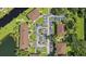 Aerial perspective showcases meticulously designed condos, parking, and lush landscaping near the serene pond at 19505 Quesada Ave # Pp201, Port Charlotte, FL 33948