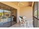 Balcony featuring outdoor seating and a peek into the connected bedroom, offering a comfortable retreat at 19505 Quesada Ave # Pp201, Port Charlotte, FL 33948