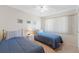 Cozy bedroom featuring two twin beds, a nightstand, and a window, perfect for relaxation at 19505 Quesada Ave # Pp201, Port Charlotte, FL 33948