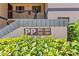 Building entrance is surrounded by lush landscaping and clearly visible signage at 19505 Quesada Ave # Pp201, Port Charlotte, FL 33948