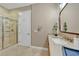 Stylish bathroom features a tiled shower, vanity with counter space, and a mirrored cabinet at 196 Tarpon Cove Blvd # 722, Punta Gorda, FL 33950