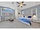 Inviting bedroom showcasing large window, comfortable seating and calming grey walls with white trim at 196 Tarpon Cove Blvd # 722, Punta Gorda, FL 33950