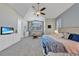 Beautiful bedroom with vaulted ceilings, a ceiling fan, and comfortable seating area by a large window at 196 Tarpon Cove Blvd # 722, Punta Gorda, FL 33950