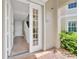 Inviting foyer with tiled floors, a staircase, an open front door, and lots of natural light at 196 Tarpon Cove Blvd # 722, Punta Gorda, FL 33950