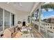 Cozy lanai offers a comfortable seating arrangement to enjoy the view of the neighborhood at 196 Tarpon Cove Blvd # 722, Punta Gorda, FL 33950