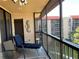 Relaxing screened balcony with a comfortable lounge chair and outdoor seating at 21405 Olean Blvd # 531, Port Charlotte, FL 33952