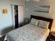 Cozy bedroom featuring queen size bed and access to closet at 21405 Olean Blvd # 531, Port Charlotte, FL 33952
