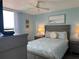 Bedroom features a queen bed, soft blue walls, and a large window at 21405 Olean Blvd # 531, Port Charlotte, FL 33952