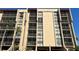 Exterior of building showcases multiple stories, screened-in balconies, and architectural details at 21405 Olean Blvd # 531, Port Charlotte, FL 33952