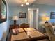 Cozy dining area featuring a tile-top table, chairs, and a view of the living room at 21405 Olean Blvd # 531, Port Charlotte, FL 33952