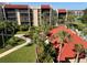 Beautiful view of condos with lush landscaping and palm trees, offering a serene setting at 21405 Olean Blvd # 531, Port Charlotte, FL 33952