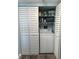 Laundry closet featuring a washer, dryer, and shelving at 21405 Olean Blvd # 531, Port Charlotte, FL 33952