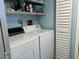 Laundry room featuring a washer, dryer, shelving and closet at 21405 Olean Blvd # 531, Port Charlotte, FL 33952