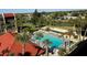 Community pool with inviting lounge chairs and palm trees providing a relaxing atmosphere at 21405 Olean Blvd # 531, Port Charlotte, FL 33952