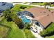 The home's screened-in pool and lush surroundings are captured in this aerial view at 25179 Campos Dr, Punta Gorda, FL 33983