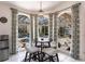 Cozy breakfast nook features views of the pool and a round table at 25179 Campos Dr, Punta Gorda, FL 33983
