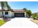 Well maintained single-story home with an attached two-car garage, a concrete driveway, and low-maintenance landscaping at 25179 Campos Dr, Punta Gorda, FL 33983