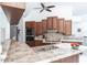 Kitchen features wood cabinetry, updated appliances, and a breakfast bar at 25179 Campos Dr, Punta Gorda, FL 33983