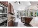 Kitchen boasts stainless steel appliances, a breakfast bar, and views of the pool at 25179 Campos Dr, Punta Gorda, FL 33983
