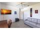 A living room boasts a couch and mounted television, creating a relaxing entertainment space at 25179 Campos Dr, Punta Gorda, FL 33983