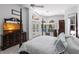Bright main bedroom with pool views and modern furniture at 25179 Campos Dr, Punta Gorda, FL 33983