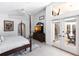 A well lit main bedroom with tiled floors, ceiling fan, and private patio access at 25179 Campos Dr, Punta Gorda, FL 33983