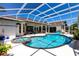 Screened pool area with a hot tub and an outdoor shower at 25179 Campos Dr, Punta Gorda, FL 33983