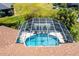 Aerial view of the screened-in pool and spa area at 25179 Campos Dr, Punta Gorda, FL 33983