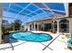 A screened-in pool and patio are perfect for enjoying the outdoors in comfort at 25179 Campos Dr, Punta Gorda, FL 33983