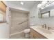 Accessible bathroom featuring a walk-in shower, safety bars, and modern vanity at 309 Aurora St, Port Charlotte, FL 33948