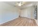 Bedroom featuring hardwood-look floors, ceiling fan, and double closet at 309 Aurora St, Port Charlotte, FL 33948