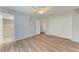 Spacious bedroom with wood-look floors, ceiling fan, and large closet for ample storage at 309 Aurora St, Port Charlotte, FL 33948