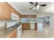 Fully equipped kitchen featuring granite countertops, stainless steel appliances, and an open design at 309 Aurora St, Port Charlotte, FL 33948