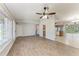 Spacious living area featuring wood floors, ample natural light, and an open layout at 309 Aurora St, Port Charlotte, FL 33948