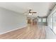 Expansive living room showcasing stylish wood flooring and an easy transition to the kitchen at 309 Aurora St, Port Charlotte, FL 33948