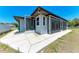This home features a large screened-in porch area, perfect for outdoor relaxation and entertainment at 309 Aurora St, Port Charlotte, FL 33948