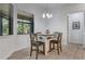 Bright breakfast nook with a square table, wood chairs, and natural light at 3136 Joshua St, Port Charlotte, FL 33948