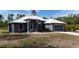 Charming single-story home featuring a modern metal roof and a well-manicured lawn at 3136 Joshua St, Port Charlotte, FL 33948