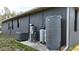Home exterior featuring a water filtration system and a modern air conditioning unit at 3136 Joshua St, Port Charlotte, FL 33948
