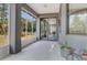 Inviting screened patio with comfortable seating, perfect for relaxing and enjoying the outdoors at 3136 Joshua St, Port Charlotte, FL 33948