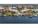 Real estate featuring a community pool, boat docks, and well-maintained landscaping in a beautiful waterfront setting at 3221 White Ibis Ct # D2, Punta Gorda, FL 33950