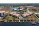 An aerial view of the condo complex with a pool, boat docks, waterfront access, and well-kept grounds at 3221 White Ibis Ct # D2, Punta Gorda, FL 33950