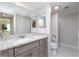 Bathroom featuring a granite vanity, neutral walls, and plenty of light at 3221 White Ibis Ct # D2, Punta Gorda, FL 33950