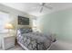 Charming bedroom with light-colored walls, wicker furniture, and a ceiling fan at 3221 White Ibis Ct # D2, Punta Gorda, FL 33950