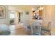 Cozy dining area with tile floors, a glass table, and natural lighting at 3221 White Ibis Ct # D2, Punta Gorda, FL 33950